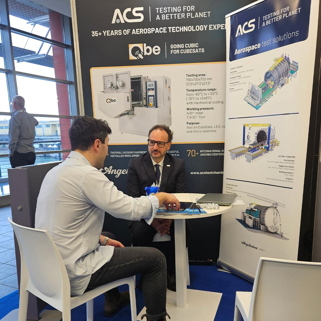 Business meeting at the ACS stand during Space Meetings Veneto, the international event dedicated to space and satellite technologies in Venice.