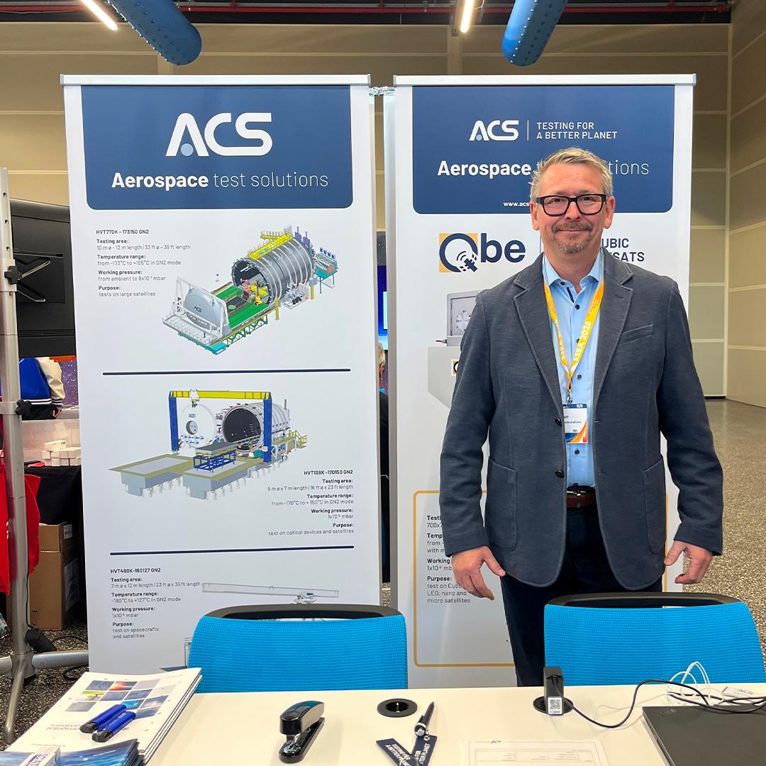 ACS representative at the booth showcasing aerospace test solutions at the SSEA Symposium in Monaco
